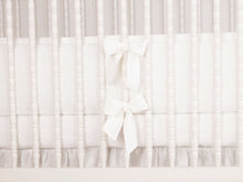 White linen crib bumper with short ties