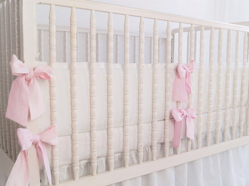 White linen crib bumper with pink  ties