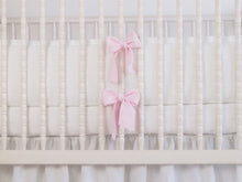 White linen crib bumper with pink  ties