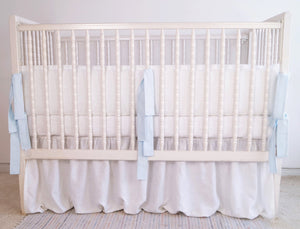 White linen crib bumper with pink  ties